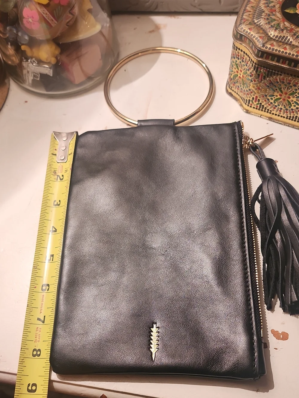 Thacker Black Leather Wristlet Clutch with Gold Ring Handle